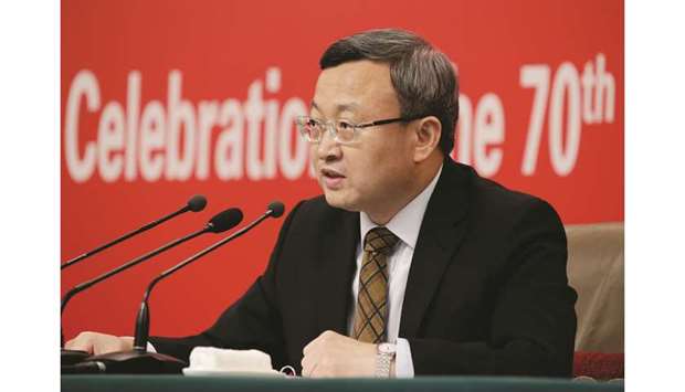 Chinese Vice Commerce Minister and Deputy China International Trade Representative Wang Shouwen attends a news  conference in Beijing yesterday. He said he hoped both China and the US would find ways to resolve their differences.