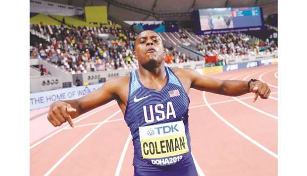 Christian Coleman of the US celebrates winning 100m gold medal at the Khalifa International Stadium in Doha on Saturday. (Reuters)