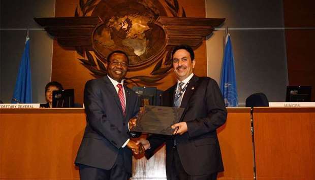 QCAA chairman Abdullah bin Nasser Turki al-Subaey receiving a certificate of appreciation from the ICAO president Dr Olumuyiwa Benard Aliu