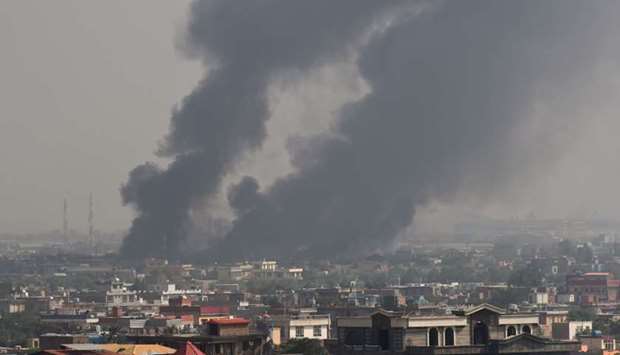 Smoke rises from the site of an attack after a massive explosion the night before near the Green Village in Kabul. AFP