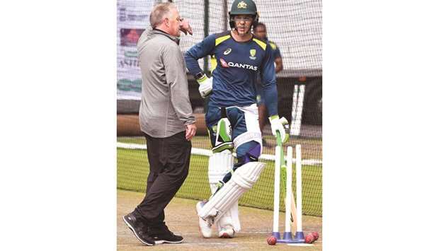 Former Australia wicketkeeper Ian Healy (left) chats with Australia captain Tim Paine in the nets during a training session at Old Trafford in Manchester, United Kingdom, yesterday. (AFP)