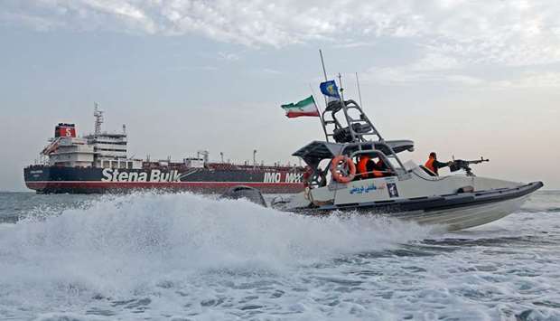In this file photo taken on July 21, 2019, Iranian Revolutionary Guards patrol around the British-flagged tanker Stena Impero as it's anchored off the Iranian port city of Bandar Abbas.