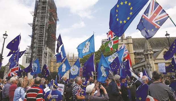 Anti-Brexit protesters march outside the Houses of the Parliament in London yesterday. Markets fear that a no-deal Brexit could be disastrous for the British economy, at least in the short term, and could plunge the country into recession.