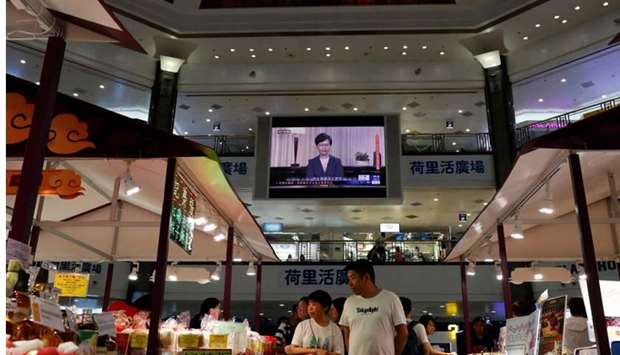 A news conference of Hong Kong's Chief Executive Carrie Lam is televised in a shopping mall in Hong Kong, China