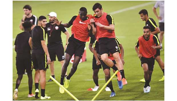 Qatar national team players take part in a training session on the eve of their 2022 FIFA World Cup and the 2023 Asian Cup qualifying match against Afghanistan yesterday. PICTURES: Noushad Thekkayil