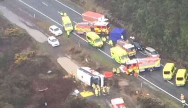 An aerial view of the accident scene that shows the  rolled over bus and the police and the emergency vehicles. Photo courtesy: 1 NEWS, New Zealand
