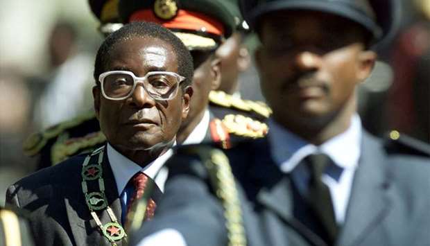 Robert Mugabe inspects troops at the opening of Parliament on July 20, 2000