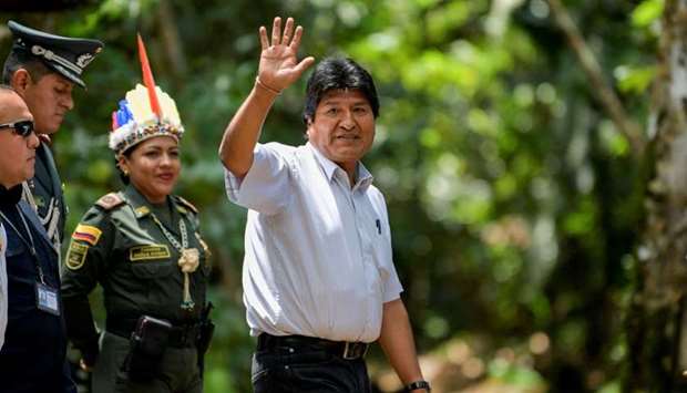 Bolivia's President Evo Morales waves as he arrives for the Presidential Summit for the Amazon at the National University in Leticia, department of Amazonas, Colombia, on September 4