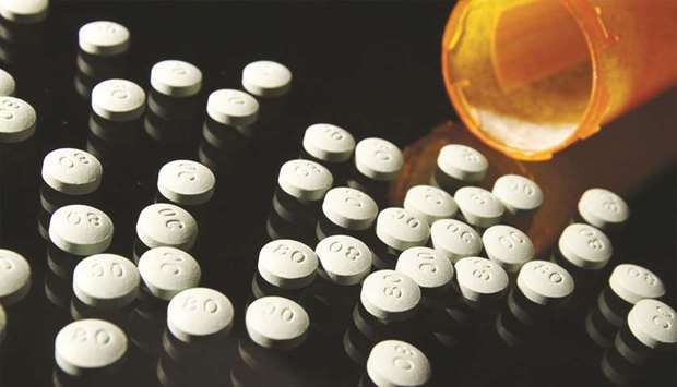 OxyContin is a culprit in the opioid epidemic, leading cities and states to seek compensation from the US pharmaceutical industry. Ohio Attorney-General Dave Yost argues that states, not local governments, can get the best settlement. (File photo)