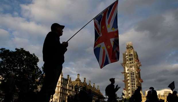 A composite Union and EU flag is seen on Parliament Square outside the Houses of Parliament in central London