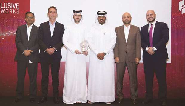 Ooredoo Qatar chief business officer Sheikh Nasser bin Hamad bin Nasser al-Thani with the award during celebrations held in Doha.