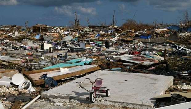 A child's bicycle is seen in a destroyed neighborhood in the wake of Hurricane Dorian in Marsh Harbour