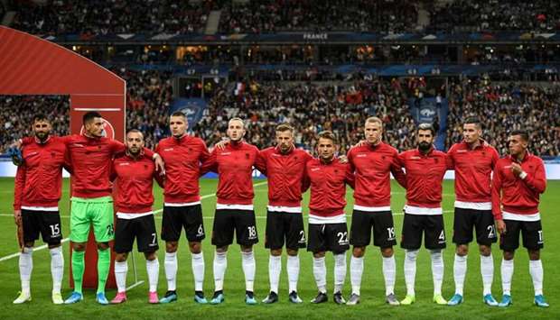 Albania's players stand during the national anthems ceremony before the kick off of the UEFA Euro 2020 qualifying Group H football match between France and Albania at the Stade de France stadium in Saint-Denis yesterday