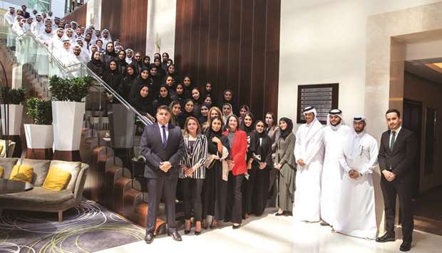 The new u2018graduate developeesu2019 with Qatar Airways officials.
