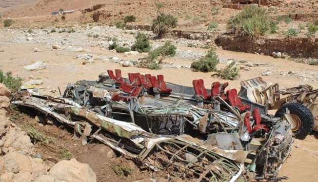 The wreckage of a bus, following a flood-related accident at the Damchan river near the city of Errachidia, in the El Khank region in southern Morocco