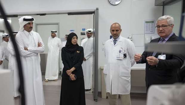 His Highness the Amir Sheikh Tamim bin Hamad al-Thani listens to a briefing about the treatment and care at the new Trauma and Emergency Center.