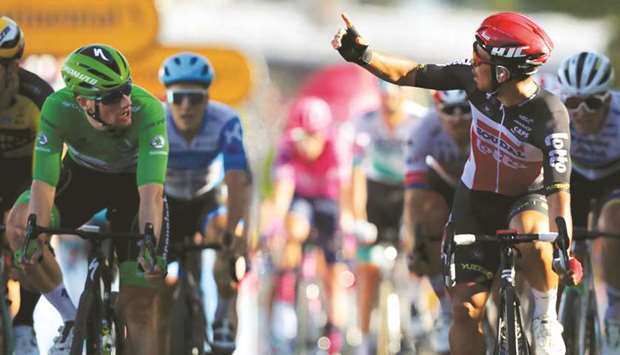Team Lotto rider Australiau2019s Caleb Ewan (right) celebrates as he crosses the finish line ahead of Team Deceuninck rider Irelandu2019s Sam Bennett at the end of the 11th stage of the 107th edition of the Tour de France race in Poitiers, France, yesterday. (AFP)