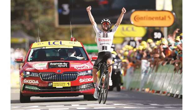 Team Sunweb rider Switzerlandu2019s Marc Hirschi celebrates after winning the 12th stage at the Tour de France in Sarran, France. (AFP)