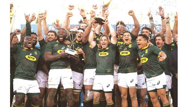 This file photo taken on August 10, 2019 shows South Africau2019s players celebrating after winning the Rugby Championship.