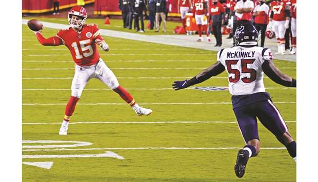 Kansas City Chiefs quarterback Patrick Mahomes (left) throws a pass during the NFL game against Houston Texans in Kansas City, Missouri, United States, on Thursday. (USA TODAY Sports)