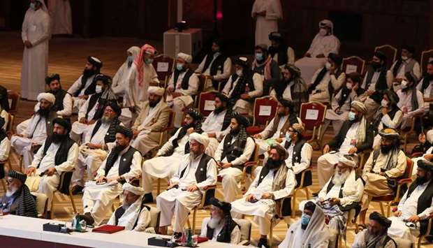 Members of the Taliban delegation attend the opening session of the peace talks in Doha.