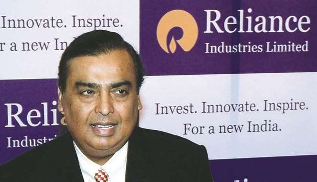 Reliance Industries chairman Mukesh Ambani poses on his arrival for the company's annual general mee