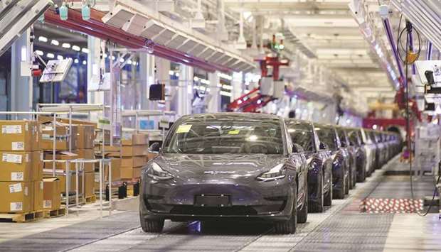 Tesla China-made Model 3 vehicles are seen during a delivery event at its factory in Shanghai (file). Tesla Inc plans to ship cars made at its Shanghai factory to other countries in Asia and Europe, according to people familiar with the matter, shifting its strategy for the plant to largely focus on supplying the local market.