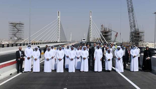 Officials at the opening of the first phase of Sabah Al Ahmad Corridor on Saturday. Seen in the background is Qatar\'s first cable-stayed bridge, which is now partially open. PICTURE: Shemeer Rasheed