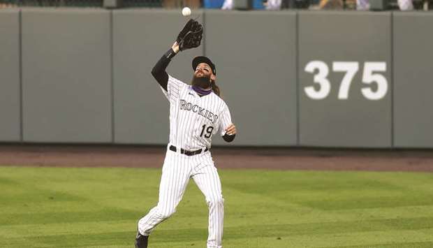Colorado Rockies right fielder Charlie Blackmon makes a catch in the first inning against the Los Angeles Angels at Coors Field in Denver. (USA TODAY Sports)
