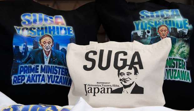 Merchandise featuring Japanu2019s expected new prime minister Yoshihide Suga are displayed at designer Ippei Fujitau2019s store Marble in Yuzawa, Akita Prefecture, Japan, on Friday.