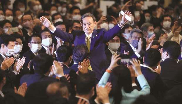 Japanu2019s Chief Cabinet Secretary Yoshihide Suga reacts after he was elected as new head of Japanu2019s ruling Liberal Democratic Party (LDP) at the partyu2019s leadership election in Tokyo yesterday.