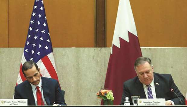 HE Sheikh Mohamed and Pompeo signing an agreement on the sidelines of the strategic dialogue in Washington