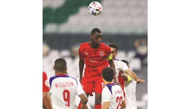 Al Duhailu2019s Almoez Ali (centre) in action during the AFC Champions League Group C match against Sharjah at Education City Stadium yesterday.