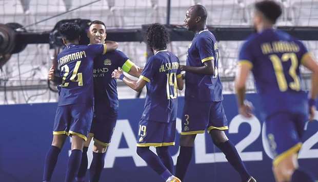 Al Nassru2019s Abderazak Hamdallah (second from left) celebrates his goal with teammates during the AFC Champions League Group D match against Sepahan at Jassim Bin Hamad Stadium yesterday. PICTURES: Noushad Thekkayil
