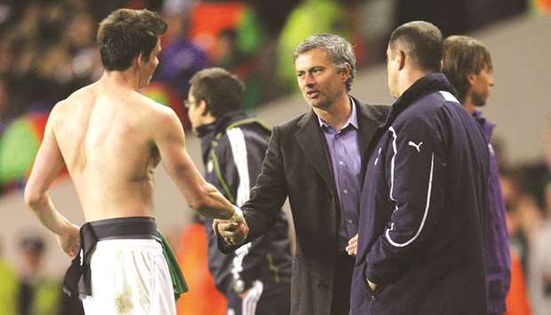 In this April 13, 2011, picture, the then Real Madrid coach Jose Mourinho (centre) shakes hands with Tottenhamu2019s Gareth Bale after the UEFA Champions League match in London. (Reuters)