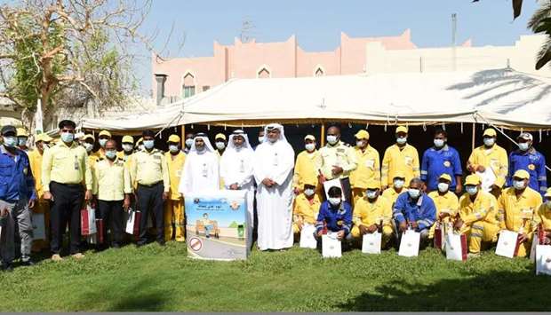 Workers honoured by MME, beach cleaned up