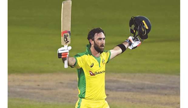 Australiau2019s Glenn Maxwell celebrates reaching his century against England on Wednesday.