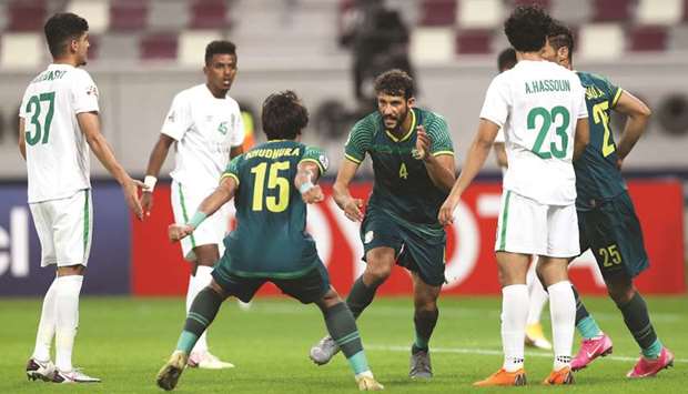 Al Shortau2019s Saad Natiq (centre) celebrates his goal with teammates during the Group A match against Al Ahli Saudi FC at Khalifa International Stadium yesterday (Twitter/TheAFCCL)