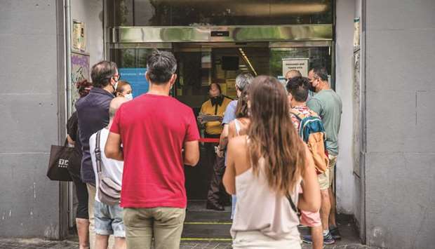 Job seekers queue for their appointments outside a regional employment office in Barcelona. The prospect that around one-fifth of Spainu2019s labour force could be unemployed for several years heaps pressure on Socialist Prime Minister Pedro Sanchez to extend the countryu2019s furlough programme beyond its September 30 expiration date.