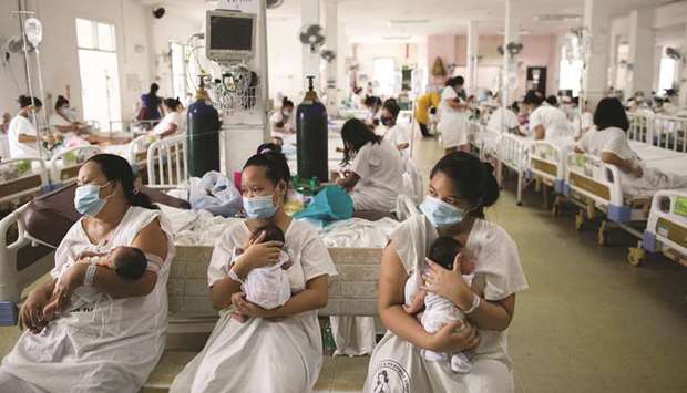 Mothers carrying their newborn babies queue for a check-up inside the maternity ward of the government-run Dr Jose Fabella Memorial Hospital, amid the coronavirus disease (Covid-19) outbreak, in Manila, yesterday.