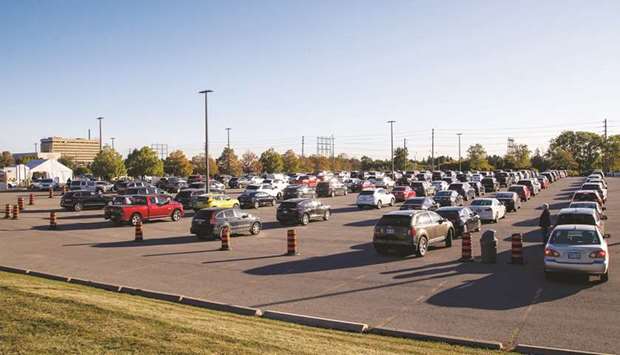 People wait in their cars at the Etobicoke General Hospital Drive-Thru coronavirus disease testing facility in Etobicoke, Ontario, Canada, yesterday.