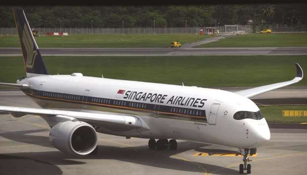 A Singapore Airlines passenger jet taxis along the tarmac as it arrives at Changi International Airport in Singapore (file).