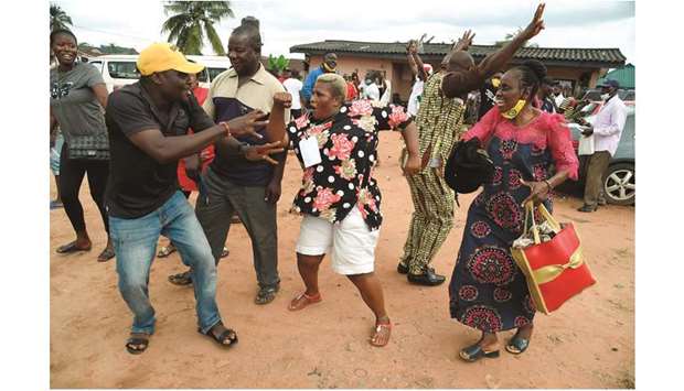 Party supporters dance to celebrate candidate of Peopleu2019s Democratic Party (PDP) Godwin Obasekiu2019s victory at a ward after the Edo State governorship elections in Benin City, Midwestern Nigeria, yesterday.