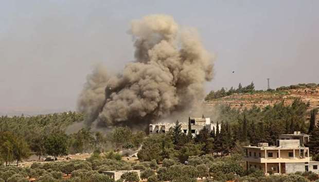 Smoke billows following a reported Russian airstrike on the western outskirts of the mostly rebel-held Syrian province of Idlib