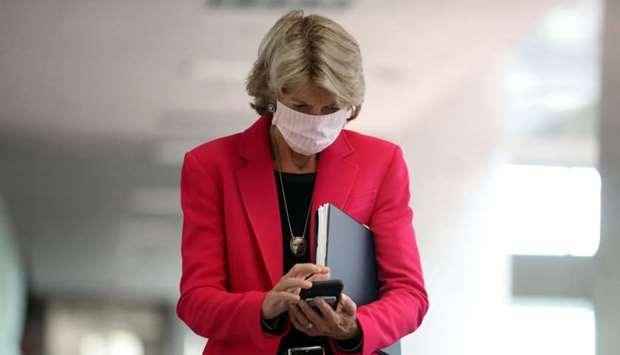 Wearing a face mask to reduce the risk posed by the coronavirus, Sen. Lisa Murkowski arrives for a Republican senate luncheon in the Hart Senate Office Building on Capitol Hill September 16, 2020 in Washington, DC.