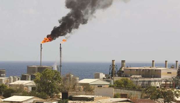 A general view of the oil installation in Zawiya (file). Libya has moved closer to reopening its battered oil industry after the state energy firm said it would resume exports, though only from fields and ports that are free of foreign mercenaries and other fighters.