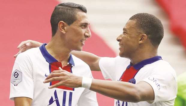 Paris St Germainu2019s Angel Di Maria (left) celebrates scoring their second goal with Kylian Mbappe against Nice yesterday. (Reuters)