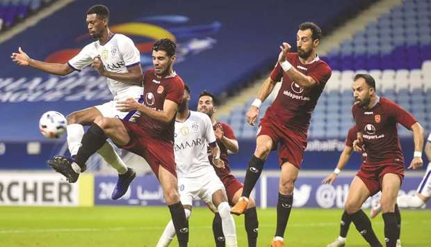 Action from the AFC Champions League Group B match between Al Hilal (in white) and Shahr Khodro (in maroon). PICTURE: Noushad Thekkayil