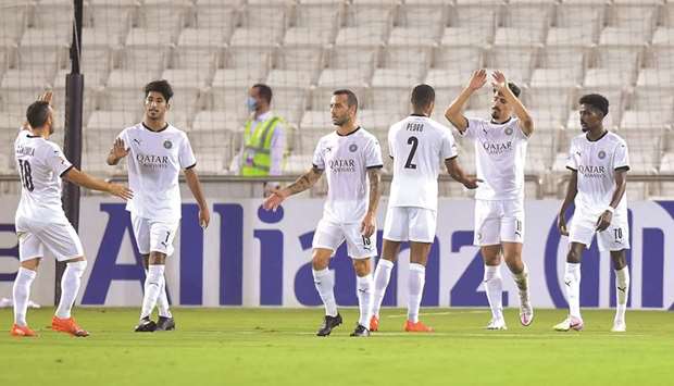 Al Sadd players celebrate a goal during the AFC Champions League match against Al Ain on Friday. PICTURES: Noushad Thekkayil