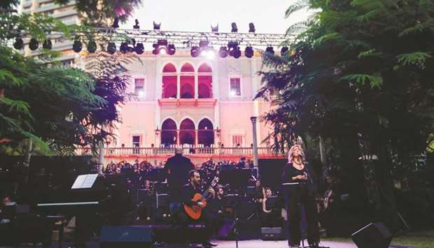 Lebanese singer Fadia Tomb performs with a choir at a concert for the victims of Augustu2019s deadly Beirut blast, in the gardens of the damaged 19th-century Sursock Palace in Achrafieh in Lebanonu2019s capital, yesterday.